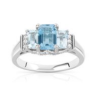 Bague or 375 blanc topaze bleue traitée et diamant