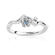Bague or 375 blanc topaze bleue traitée et diamant