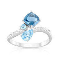 Bague or 375 blanc topaze bleue traitée