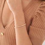 Bracelet FOSSIL acier inoxydable doré rose rigide - vue porté 1