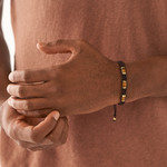 Bracelet FOSSIL acier inoxydable doré cordon brun et oeil de tigre - vue porté 1