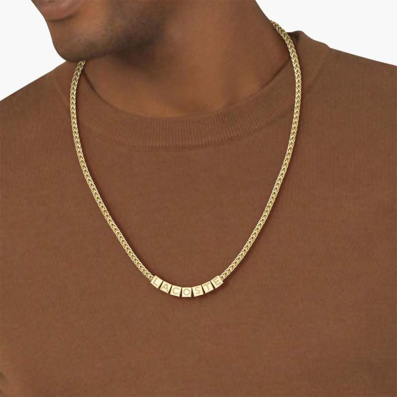 Chaine LACOSTE script acier inoxydable doré - vue porté 1