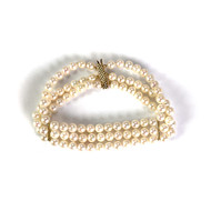 Bracelet d'occasion or 750 jaune perles du japon triple rangs 18 cm