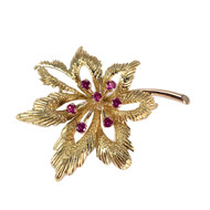 Broche d'occasion or 750 jaune rubis synthétiques