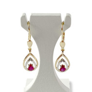 Boucles d'oreilles d'occasion or 750 2 tons dormeuses rubis taille poire et diamants