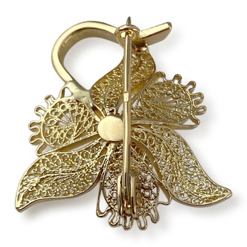 Broche d'occasion en or 750 fleur