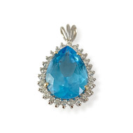 Pendentif d'occasion or 750 2 tons topaze bleue traitée diamants