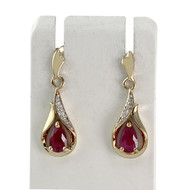 Boucles d'oreilles d'occasion or 375 jaune et rhodié rubis diamants