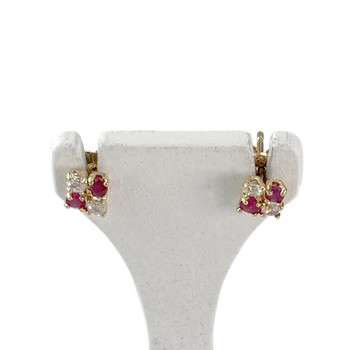 Boucles d'oreilles clous d'occasion or 750 jaune rubis zirconias