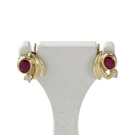 Boucles d'oreilles clous d'occasion or 750 jaune rubis zirconias