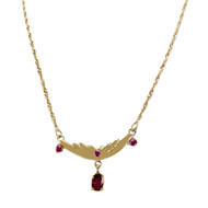 Collier d'occasion or 750 jaune torsadée rubis