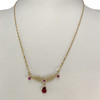 Collier d'occasion or 750 jaune torsadée rubis - vue V2