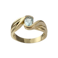 Tweedehands gouden ring 750 geel topaas hemelsblauw