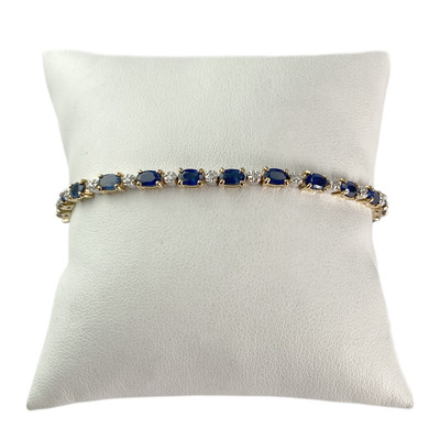 Tweedehands armband van 750 geelgoud met fantasiepatroon, saffieren en diamanten