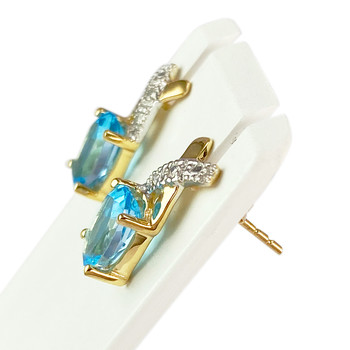 Boucles d'oreilles d'occasion 2 ors 750 topazes Swiss blue