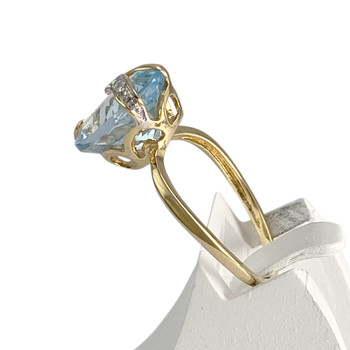 Pre-owned 18K two-tone gold ring with diamonds and a blue topaz