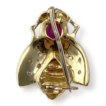Broche d'occasion or 750 jaune mouche rubis diamant