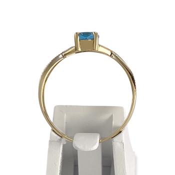 Bague d'occasion  or 750 2 tons topaze bleue traitée