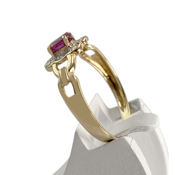 Tweekleurige tweedehands ring van 750 goud met diamant en saffier