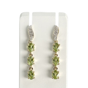 Boucles d'oreilles d'occasion 2 ors 375 diamants péridots