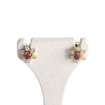 Boucles d'oreilles d'occasion or 750 jaune étoile zirconias rubis - vue 1
