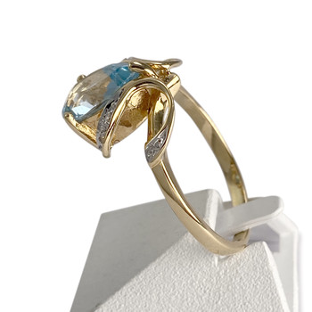 Bague d'occasion or 750 2 tons diamant topaze bleue traitée