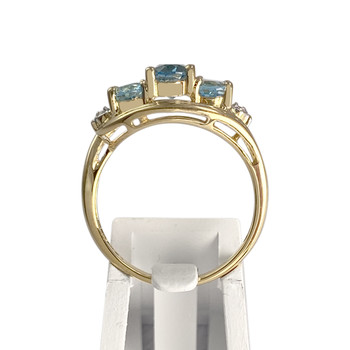 Tweekleurige tweedehands ring van 750 goud met behandelde blauwe topaas en diamanten