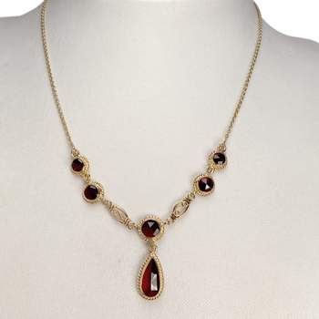 Collier d'occasion or 750 jaune maille forcat grenat