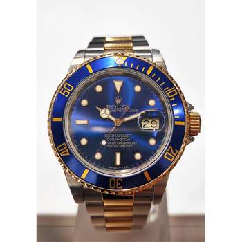 Montre d'occasion ROLEX Submariner Date homme mouvement automatique certifié (cosc) bracelet or jaune 750/000 et acier