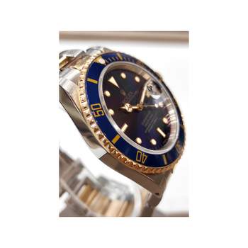 Montre d'occasion ROLEX Submariner Date homme mouvement automatique certifié (cosc) bracelet or jaune 750/000 et acier