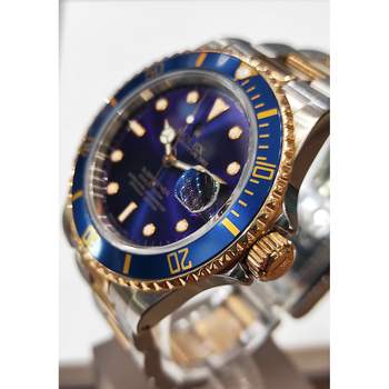 Montre d'occasion ROLEX Submariner Date homme mouvement automatique certifié (cosc) bracelet or jaune 750/000 et acier