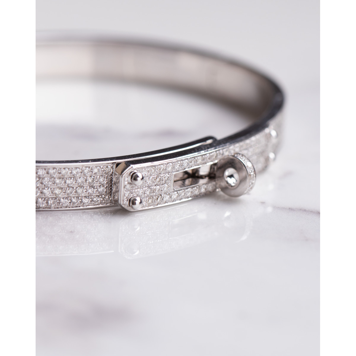 Bracelet d'occasion HERMES Kelly Petit Modèle femme or blanc 750/1000 - vue D1