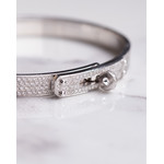 Bracelet d'occasion HERMES Kelly Petit Modèle femme or blanc 750/1000 - vue D1