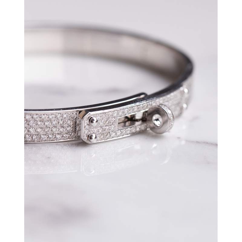 Bracelet d'occasion HERMES Kelly Petit Modèle femme or blanc 750/1000 - vue D1