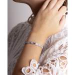 Bracelet d'occasion HERMES Kelly Petit Modèle femme or blanc 750/1000 - vue porté 2