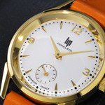 Montre Lip femme acier doré bracelet cuir orange - vue D1