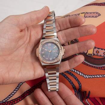 Guess Co dameshorloge van roestvrij staal in twee kleuren, roze
