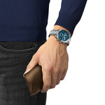 TISSOT T-SPORT PR516 men's watch with blue dial and stainless steel bracelet - worn view 1