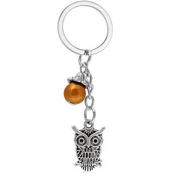 Porte-clés hibou sur une branche avec pendentif perle marron