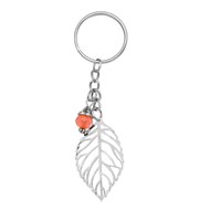 Porte-clés feuille ajourée argentée et perle à facettes orange