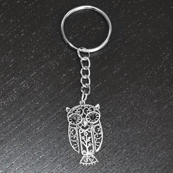 Gelede uil sleutelhanger met geciseleerd zilveren bloemenboompje