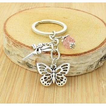 Fee vlinder en facetgeslepen roze parel sleutelhanger