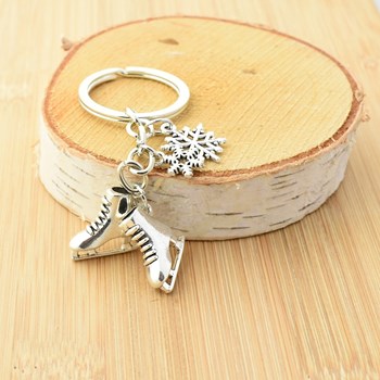 Porte-clés paire de patins à glace flocons de neige argenté