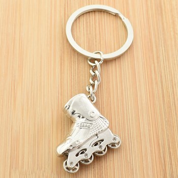 Porte-clés roller patin à roulettes argenté