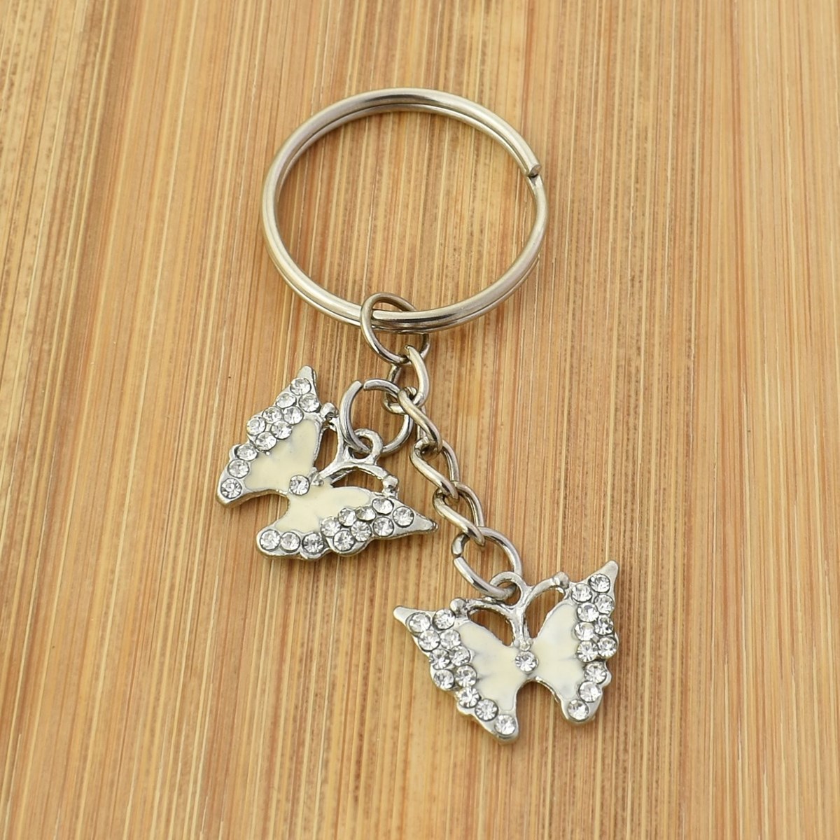Porte-clés 2 papillons émail coloré blanc strass argenté - vue 2