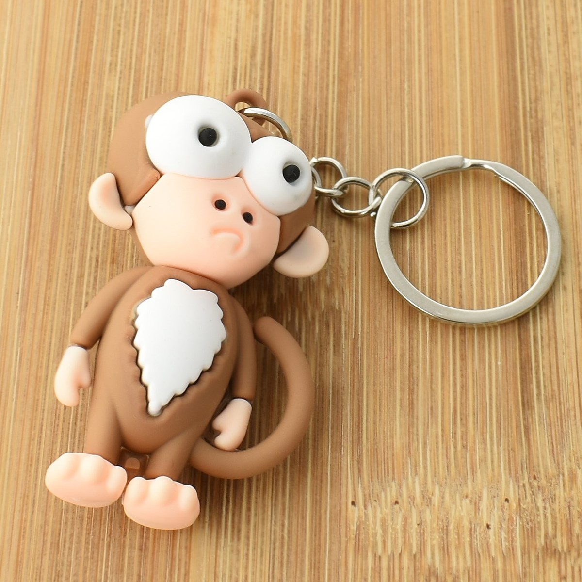 Porte-clés singe rigolo marron et blanc en 3D - vue 2