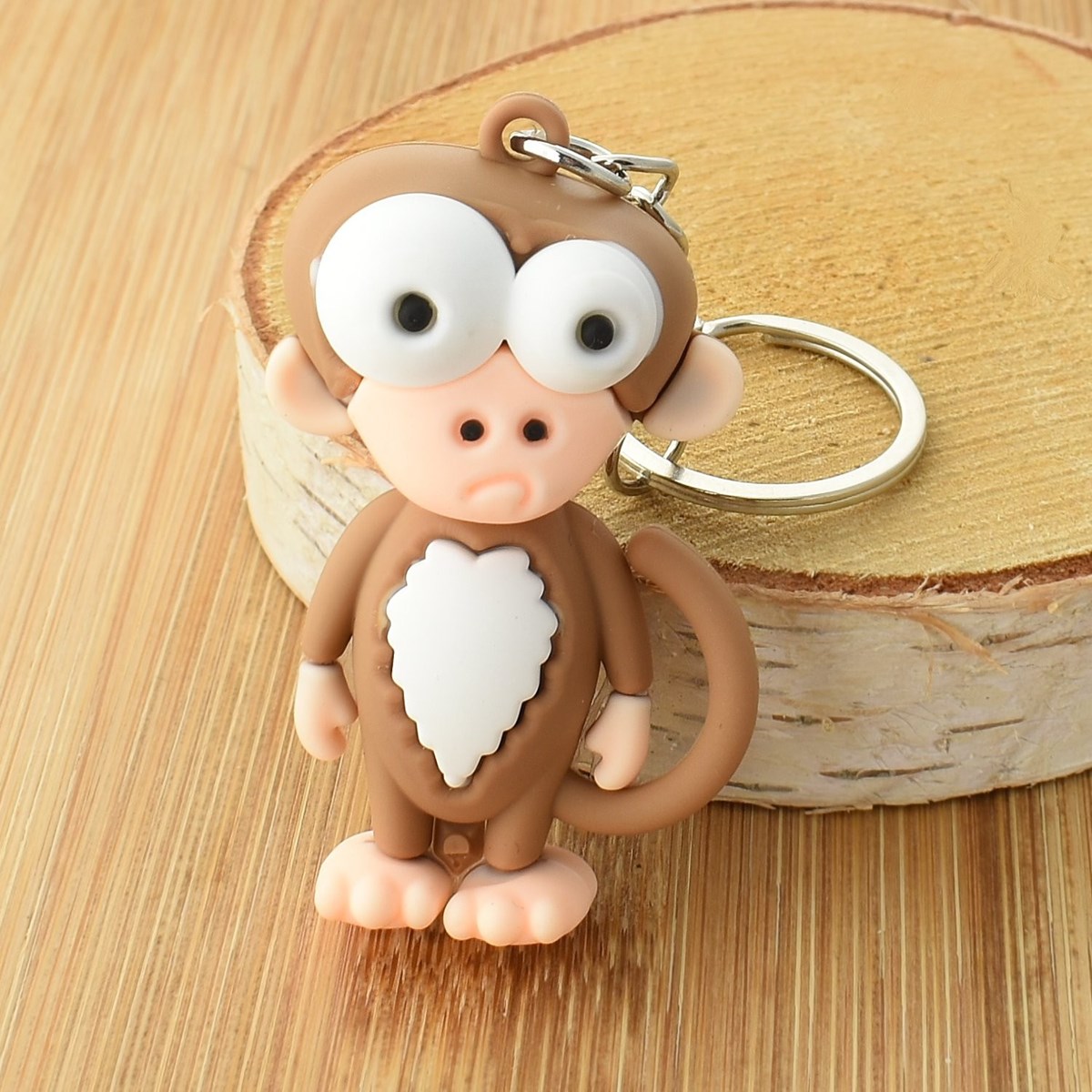 Porte-clés singe rigolo marron et blanc en 3D - vue 3