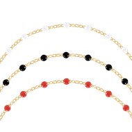 Set de trois bracelets blanc, noir et rouge en acier doré plaqué jaune
