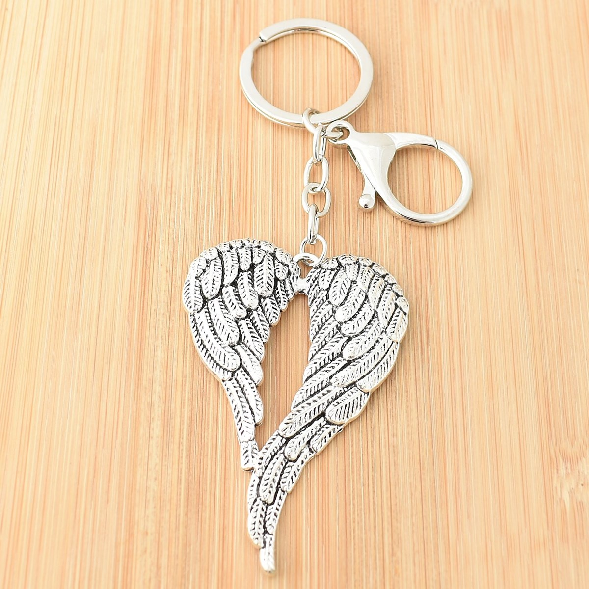 Porte-clés 2 ailes d'ange bijou de sac avec mousqueton et anneau argenté - vue 2
