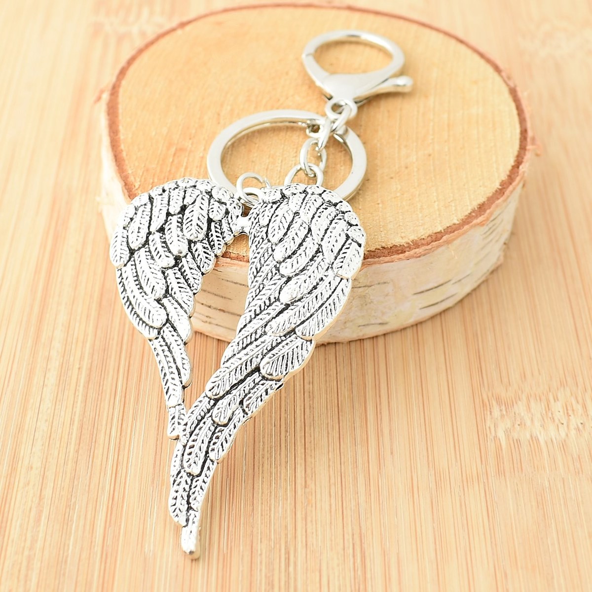 Porte-clés 2 ailes d'ange bijou de sac avec mousqueton et anneau argenté - vue 3
